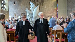 Fünf Tauben, ein Geist – die Pastoren Nagel und Petersen auf dem Weg zum Festakt